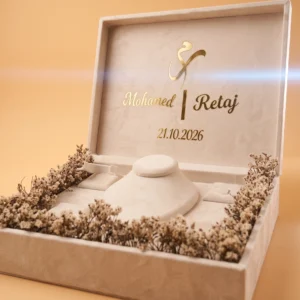 Bridal gift box open showing fitted compartments for bracelet, ring, earrings, and necklace