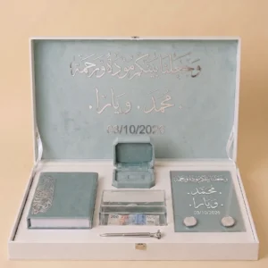 Personalized Nikah anniversary wedding gift box open to show the engraved lid, Quran booklet, ring box, and glass keepsake plaque