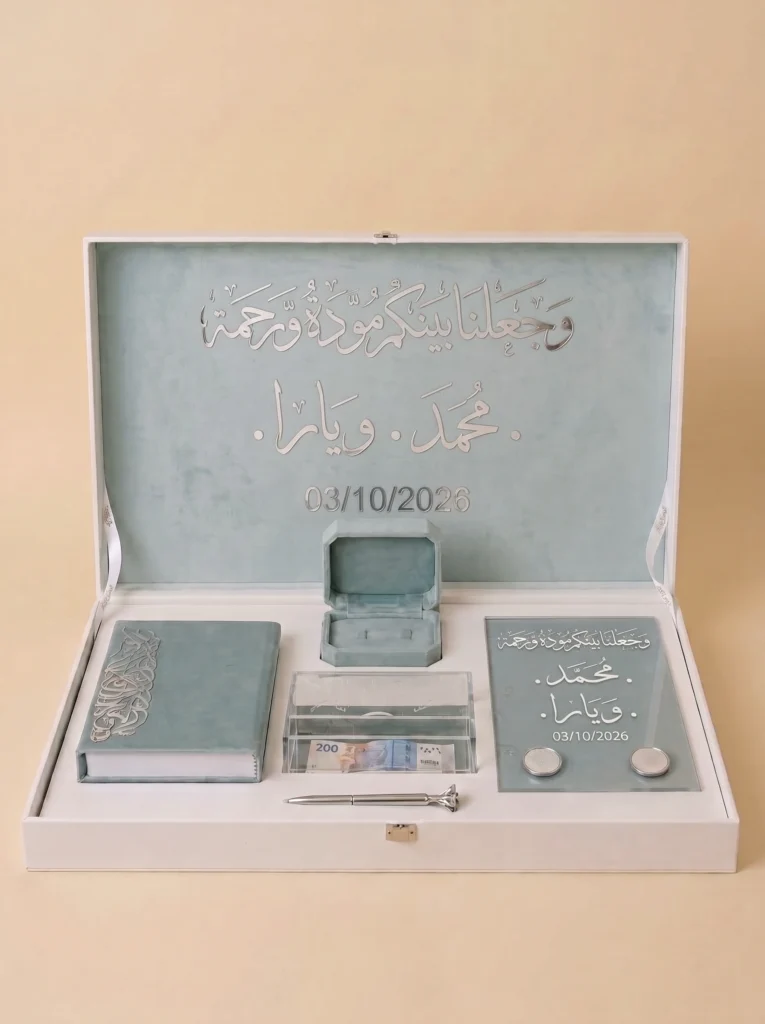 Personalized Nikah anniversary wedding gift box open to show the engraved lid, Quran booklet, ring box, and glass keepsake plaque
