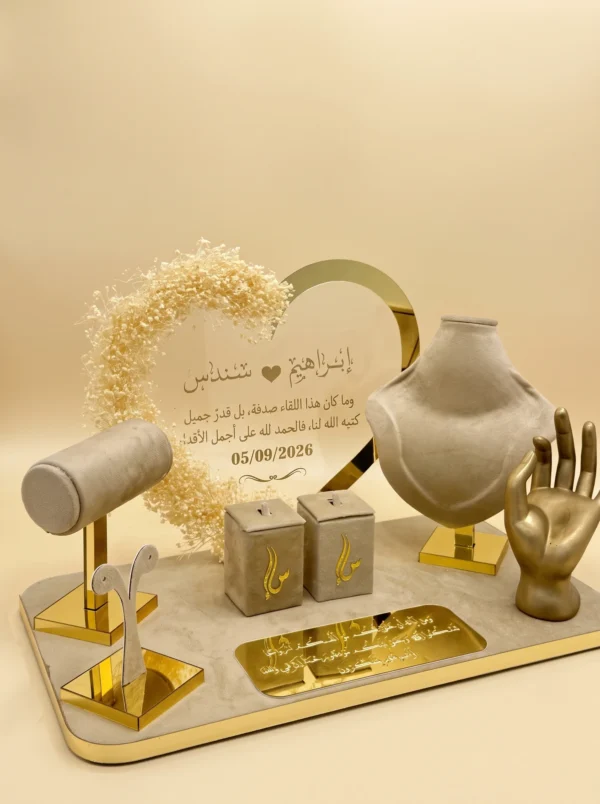 Taupe velvet presentation tray with gold heart name panel, ring boxes, bust and gold hand ring holder