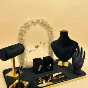Couple ideas gifts: black velvet jewelry tray with gold stands, ring boxes and floral arch with names