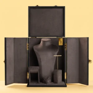 Jewelry box near me: open black cabinet with charcoal lining, necklace bust, ring and earring stands