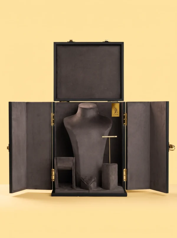 Open black jewelry cabinet with charcoal suede-look interior, necklace bust, ring and earring stands