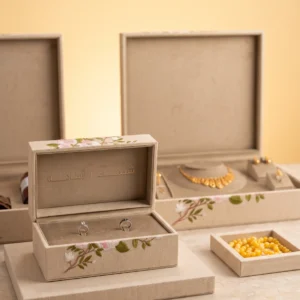 Ring boxes collection styled together: ring box, jewelry box and tray in embroidered linen