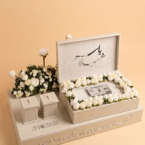 Personalized engagement gifts: cream tray with 2 ring boxes, white flowers and names in mirror calligraphy